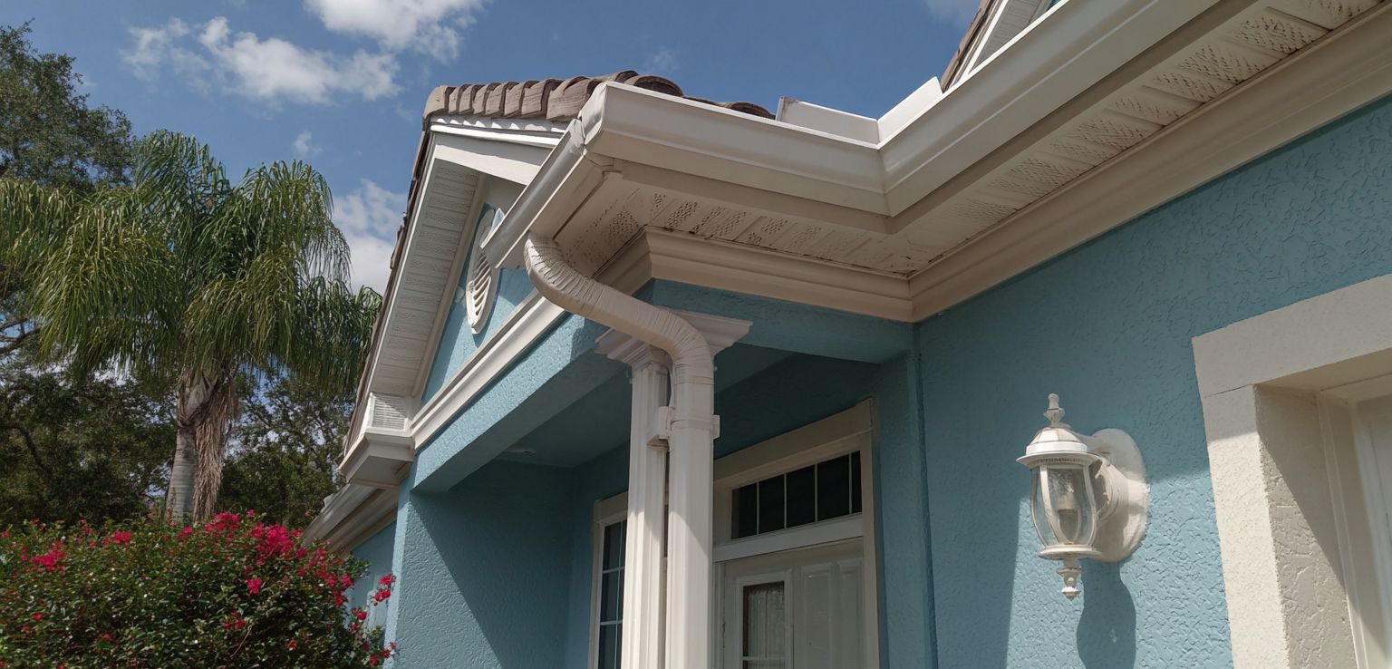 Tampa Bay gutter services installation on Mediterranean style Florida home with tile roof gutters